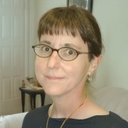 Mary Jones Woman with dark hair and dark-rimmed glasses